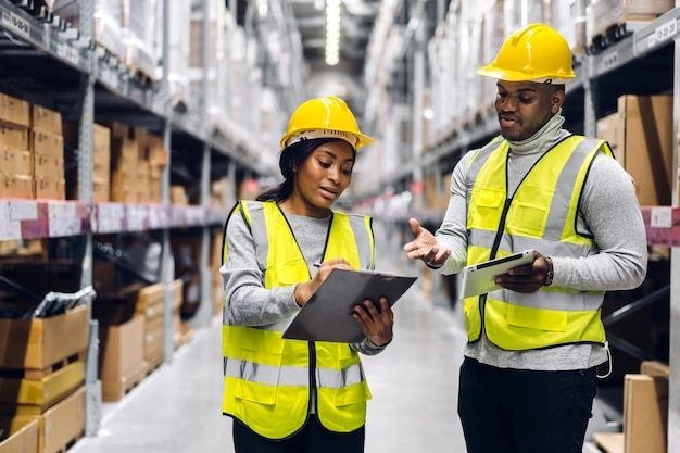 Team checking inventory on shelves in a warehouse